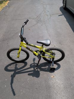 Boy's bicycle with training wheels