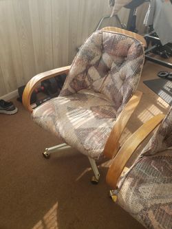 Biege dining table W/4 cloth chairs.