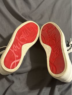 Authentic Christian Louboutin white leather low-top sneakers.