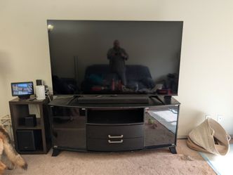 Tv with entertainment center and surround sound living room set