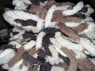 Jumbo Soft Chunky Yarn for Hand Knitting, Fluffy Variegated Chunky Chenille Yarn - Grocery Bag Full  The material has a variegated pattern of white, t