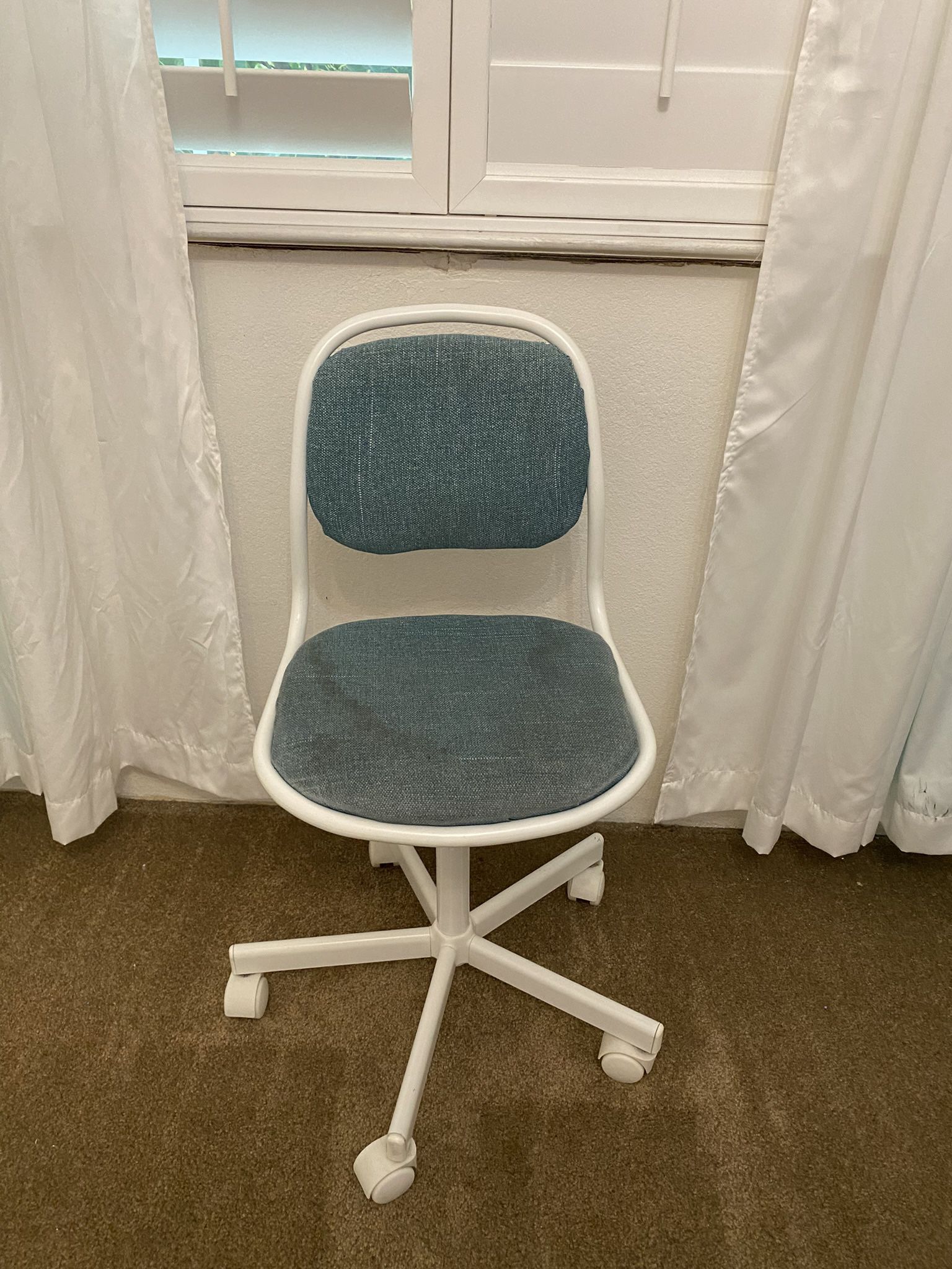 Children’s white rolling chair by Ikea 