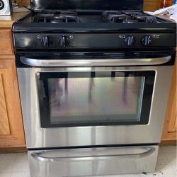 Black and Chrome Frigidaire Gas Stove