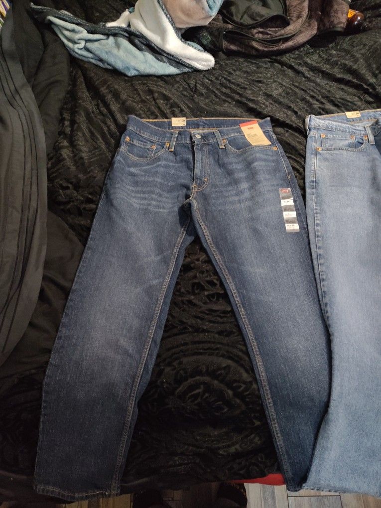 Levi 569 loose straight jeans 32x30 two pair one dark denim one light denim.