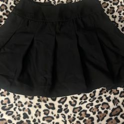 black pleated skirt