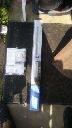 1 set of mini blinds & 1 set of new curtains