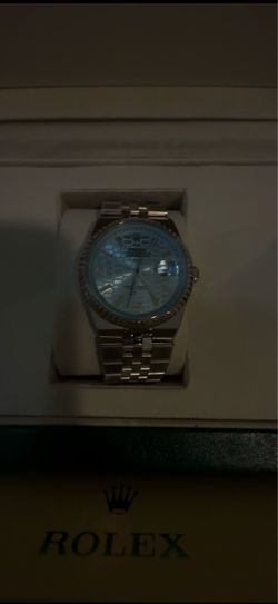 Rolex Watch with Light Blue Dial