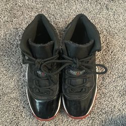 Red and Black Air Jordan 11 Retro GS Bred