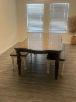 Wooden table with two bench chairs