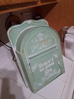 Vintage-style green "There's No Place Like Home Metal Embossed Maiilbox
