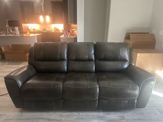 Leather dark grey power recline sofa stationary love seat