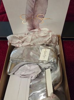Jessica Simpson metallic silver snakeskin effect slouchy pointed-toe boots.