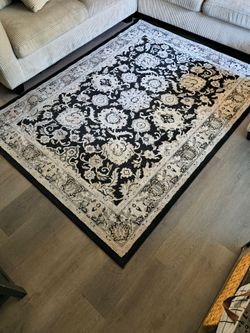 Black and beige area rug