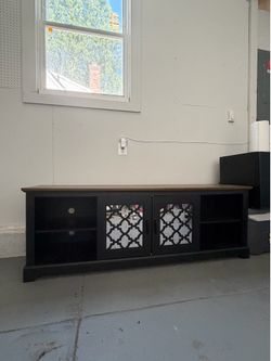 75” TV entertainment center.