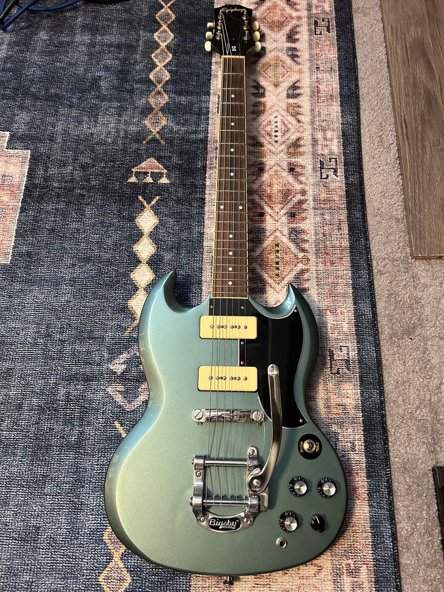 Epiphone SG Special P-90 electric guitar in Faded Pelham Blue, featuring a Bigsby vibrato tailpiece