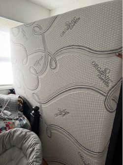 Like new King mattress  and  solid wood bed frame