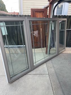New window Simonton sandstone outside oak inside. Size w119.1/4 h59.1/2 casement. $650