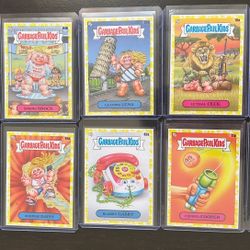 Lot of 10 Topps Garbage Pail Kids Yellow Vomit Parallel cards.