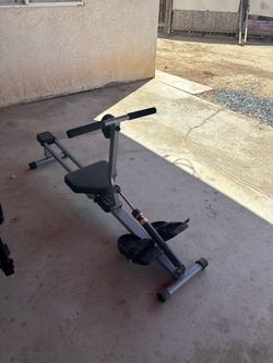 Trampoline,Punching Bag,Eliptical machine and a row machine
