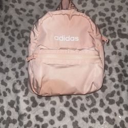 light pink adidas mini back pack with adjustable Strips