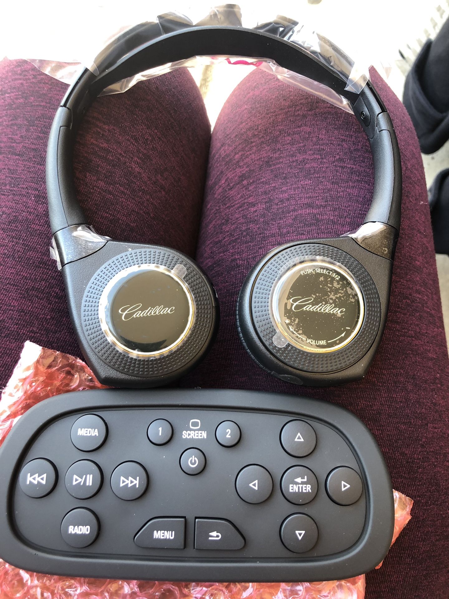 Cadillac wireless control remote and headphones