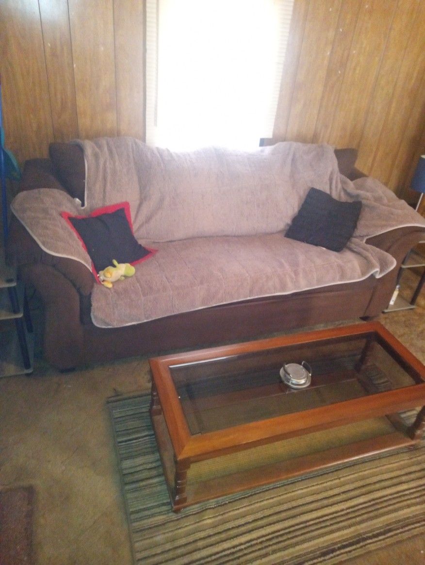 Dark Brown Couch With End Tables And Lamp And Coffee Table