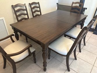 Very beautiful dining room table  like new  never used  also have leaf  to make it bigger comes with 6 Chairs in total