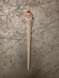 icicle ornament features a molded Santa Claus face and a spiraled  7"