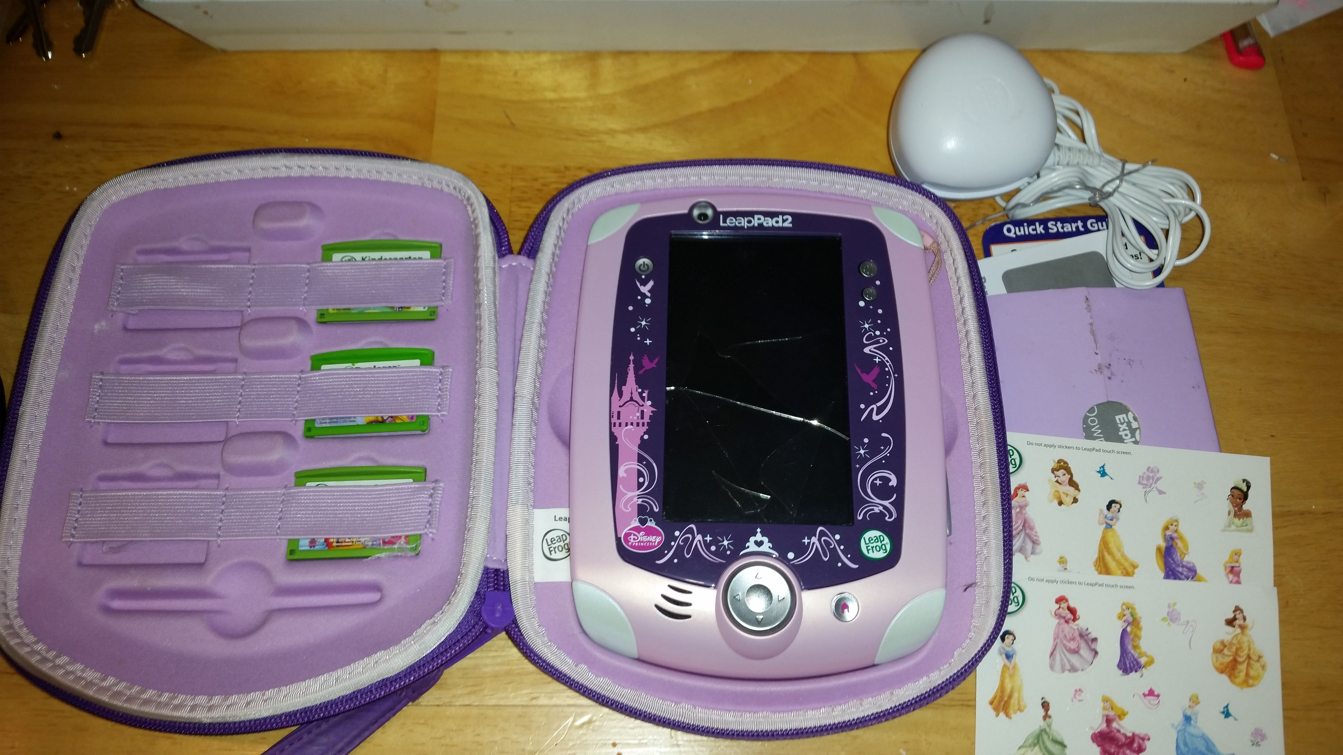 LeapPad 2 (broken, but turns on) with 3 games, a charger and a Disney princess purple case