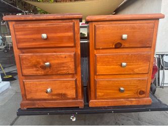solid pine bedside tables featuring a three-drawer design and metal knobs