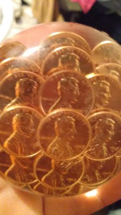 1969 pennies in epoxy paper holder