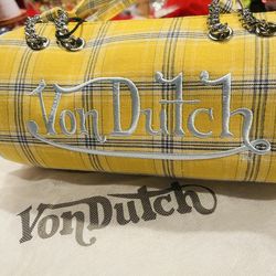 •	Brand: Von Dutch 	•	Style: Mini bowling bag / barrel bag 	•	Material: Plaid fabric with chain handles 	•	Condition: Brand new (with dust bag)