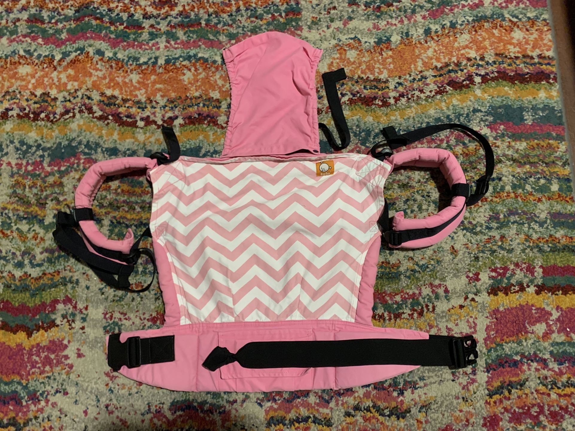 Pink chevron Tula baby carrier with removable hood