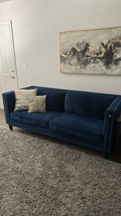 Blue Velvet loveseat with silver studded trim