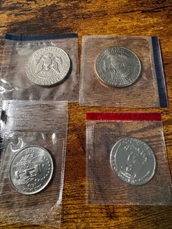 US Mint Coins in Plastic Sleeves – Lot of 4
