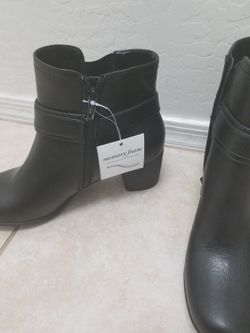 Pair of black ankle-strap side-zip chelsea boots