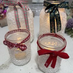 Decorative frosted holiday candle jars 
