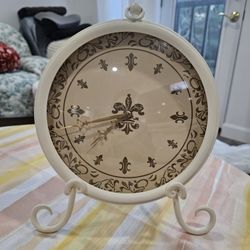 Very pretty, barely used clock with stand.