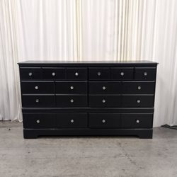 Black Eight-Drawer Double Dresser with Silver Knobs