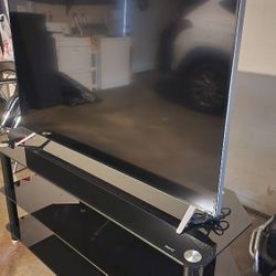 Vizio , Lamp ,tv55" Table Stand And A Black Frame Mirror. 