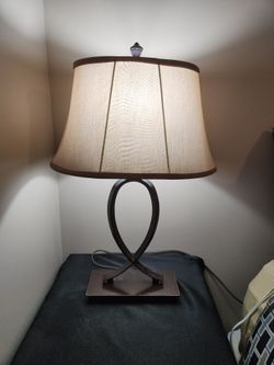 GENTLY USED BRONZE LAMP W/ TAN SHADE 26" HIGH X 16" WIDE 11" SHADE