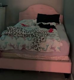 Pink upholstered bed