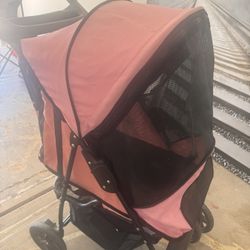 Pink dog stroller