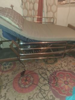 Hospital bed with remote control