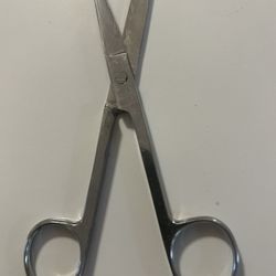 pair of stainless steel surgical operating scissors, typically used for cutting tissues or sutures in medical or veterinary settings.  Material: Stain