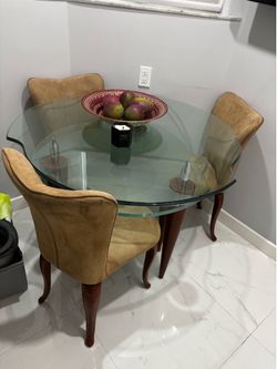 Dining room table with three small chairs