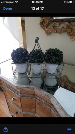 Very decorative trio topiary in farm basket adds color to any room,