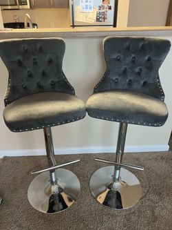 2 Gray tufted/riveted barstools