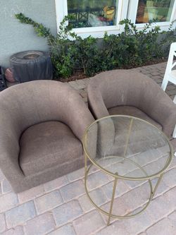 Free club chairs and glass side table
