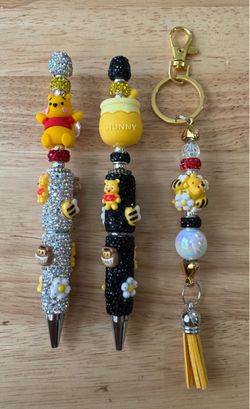 Disney’s 3 Piece “Winnie and His Hunny Pot” Beaded Pen and Bag Charm Set
